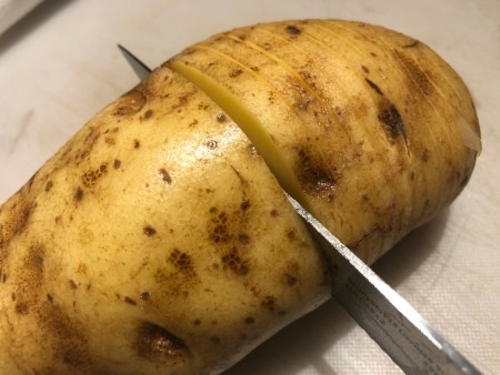 slicing potato half way thru