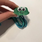 Making an Egg Carton Octopus - green glitter painted octopus with googly eyes