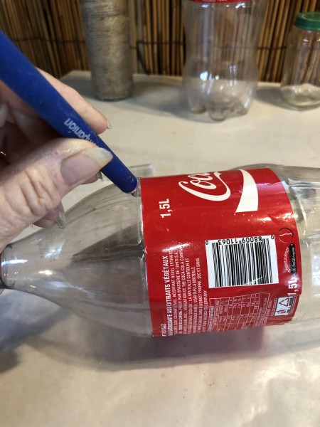 Tree Candlestick Holder - cutting the Coke bottle next to label with a knife to start