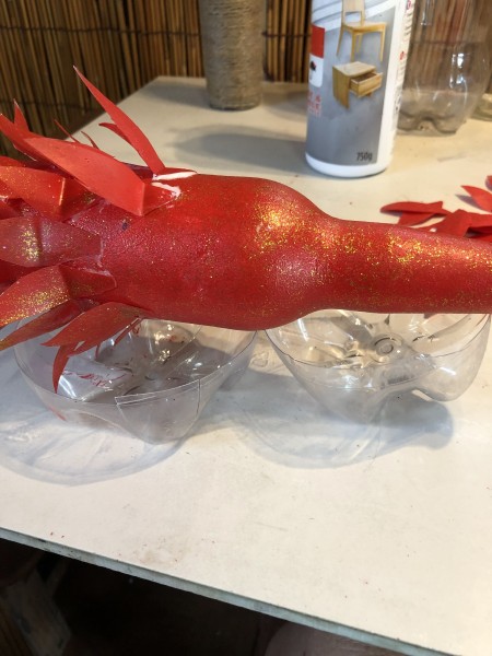 Tree Candlestick Holder - several rows glued in place, beer bottle resting on the bottoms of two liter bottles