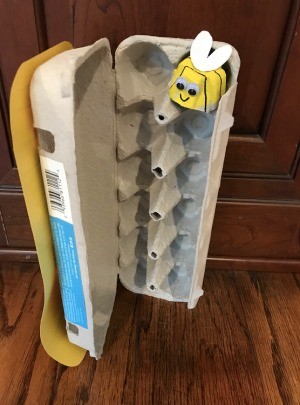 Bee and Beehive Egg Carton Toy - open hive crate with a bee in one nook