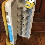 Bee and Beehive Egg Carton Toy - open hive crate with a bee in one nook