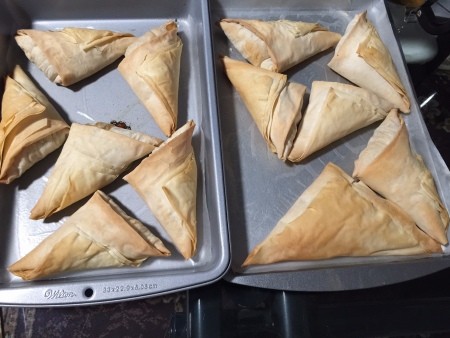 Pork Stuffed Filo Triangles on baking tray