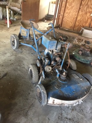Value of a 1945 Worldwind Toro Riding Mower - old mower with a seat in tandem with the mower