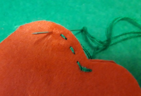 Felt Heart Hair Clip - stitch the two felt hearts together with embroidery floss, here using a running stitch