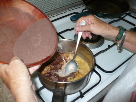 adding dry ingredients to milk
