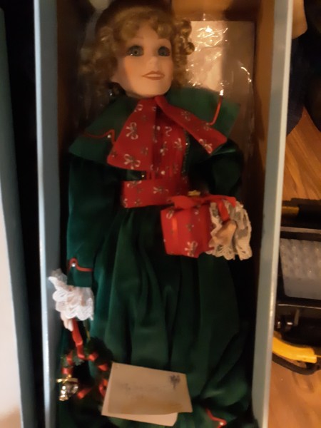Value of a Betty Jane Carter Doll - doll wearing a long dark green coat in a box