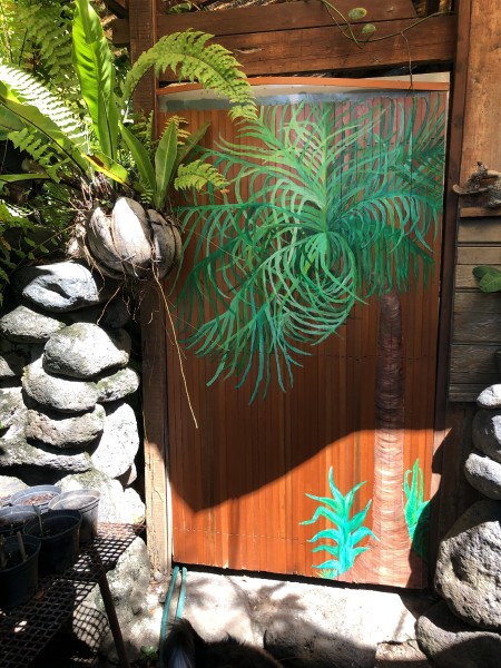 Custom Bathroom Door Design - palm tree design on door with final coats of varnish