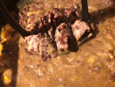 smashing Black Beans in pan