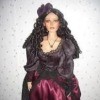 Value of a Paradise Galleries Doll - doll wearing a dark maroon gown with a dark bodice