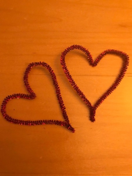 Making a Tinsel Pipe Cleaner Heart Garland - two red pipe cleaner hearts