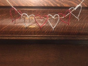 Making a Tinsel Pipe Cleaner Heart Garland - garland hanging