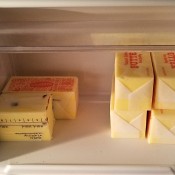 Cubes of butter in the butter section of a refrigerator.