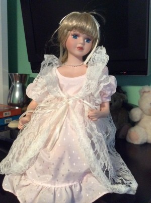 Value of a Heritage Signature Collection Doll - doll wearing a long pink dress with a long white lace over jacket