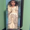 Value of an Amanda's House Porcelain Doll  - doll in a blue box, perhaps a bride doll