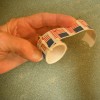 A roll of stamps tied with string.