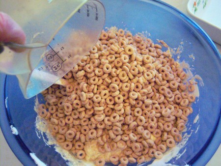 pouring marshmallow on cereal