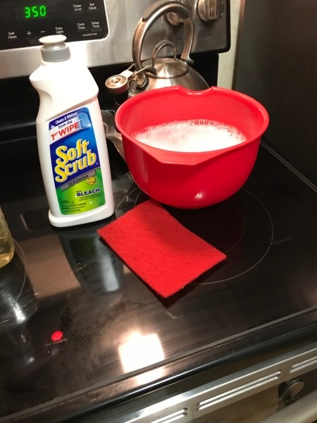 The ingredients for cleaning a stovetop hood.