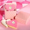 Heart shaped pink and white cookies in a pink favor box.