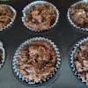 Chocolate Muffins in baking papers in tray