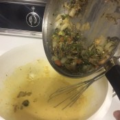 adding veggies to egg