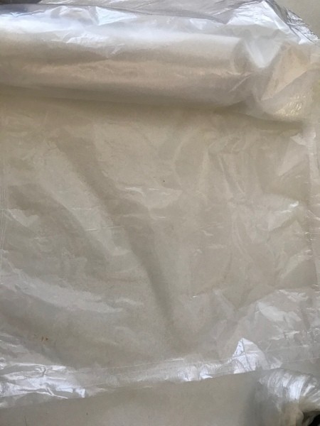 Recycled waxed paper from cereal boxes.