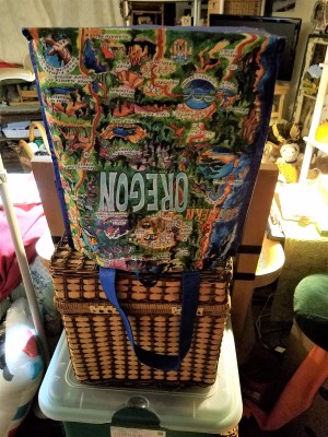 A shopping bag upended on a basket to dry.