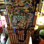 A shopping bag upended on a basket to dry.