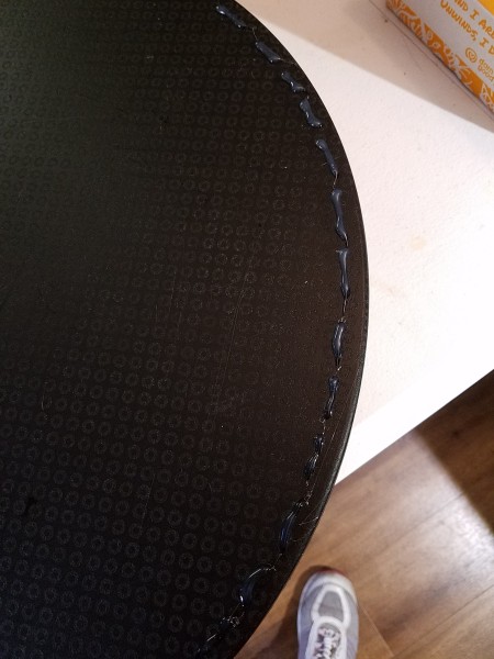 Hot glue added to the outer edge of the lap desk.