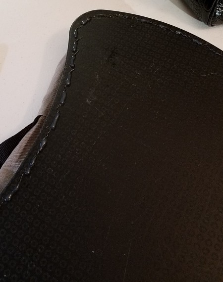 Hot glue added to the outer edge of the lap desk.