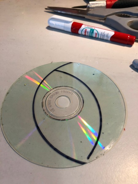 Making Feather Bookmarks from CDs - two crescents drawn