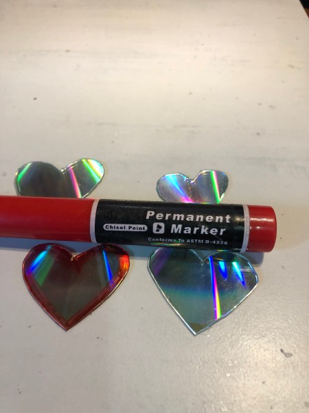 Recycled CD Mirrored Hearts - on the other side trace around the outer edge with a red marker