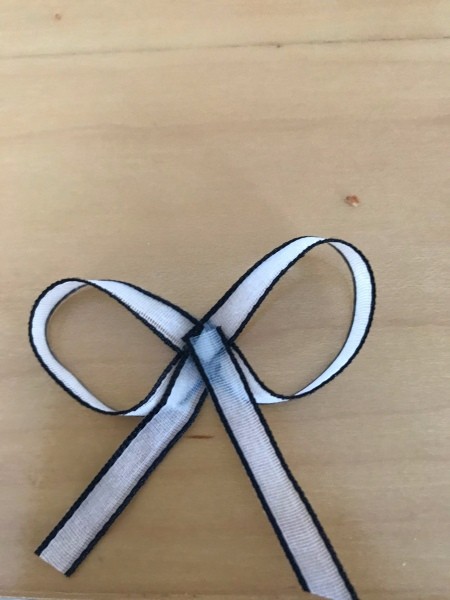 Heart Sticks Valentine's Day Arrangement - bow made from white sticker ribbon with a black edge