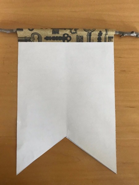 Valentine's Day Hanging Flag Banner - fold the top of the banner over the stick and glue in place