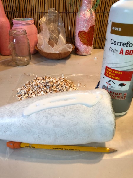 Recycled Eggshell Vase - apply glue to sections of the bottle