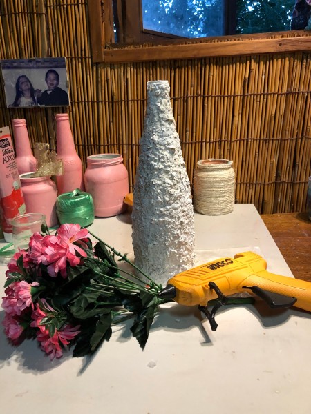 Recycled Eggshell Vase - vase with glue gun and faux flowers