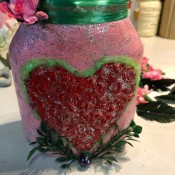 Valentine's Day Candy Jar - raffia glued around the neck and faux foliage and flowers added