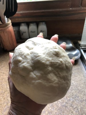 Homemade Air Dry Clay - hand holding a large ball of clay