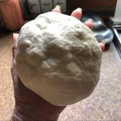 Homemade Air Dry Clay - hand holding a large ball of clay