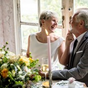 Couple sitting at a table after renewing their vows.