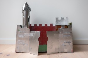 A cardboard castle painted silver.