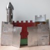 A cardboard castle painted silver.
