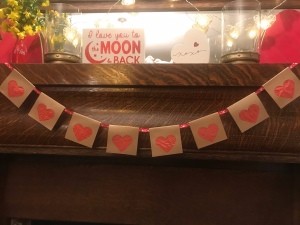 Simple Heart Garland - garland hanging on a mantel
