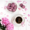 Pink peony with coffee and macarons