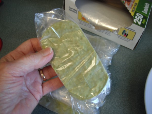 A serving of frozen guacamole wrapped up.