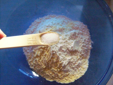 adding dry ingredients to bowl