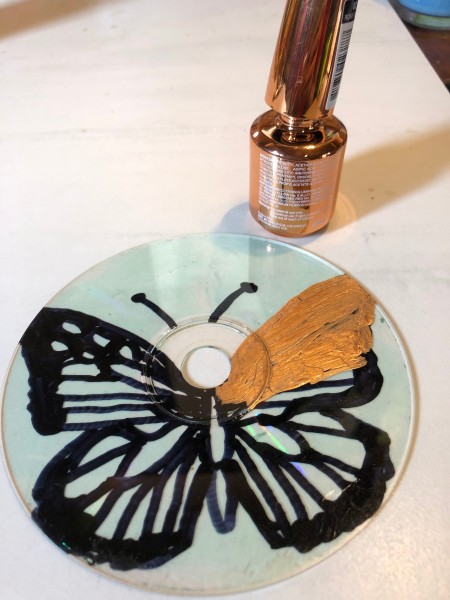 Golden Butterfly Suncatcher - cover the entire butterfly with gold nail polish on the back side