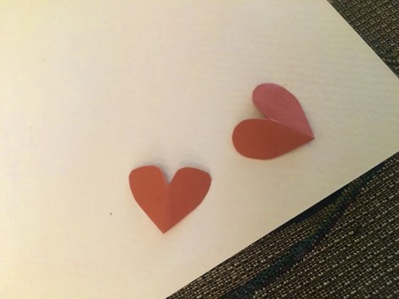 Making Hershey's Kiss Valentine Mice - cut out paper hearts for the ears