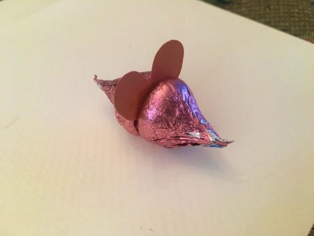 Making Hershey's Kiss Valentine Mice - glue heart to one Kiss and then glue on the other Kiss for the body