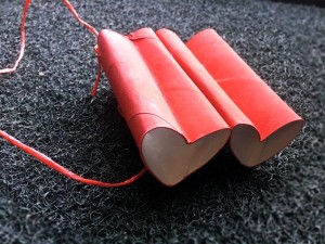 Heart-Shaped Toy Binoculars - red binoculars on dark background